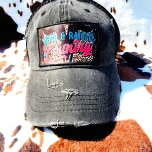 Born And Raised Country Black Distressed Patch Ponytail Hat
